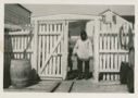 Image of Eskimo [Inuk] man standing in gateway